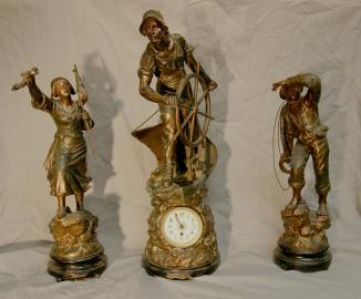 Three Spelter Maritime Statues of Helmsman, Lady Distress and Man with Lifeline