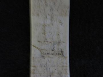 Bone Busk by a Sailor with An American Flagged Ship